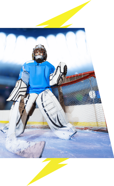 A goalie poses for the photo, weraing blue.