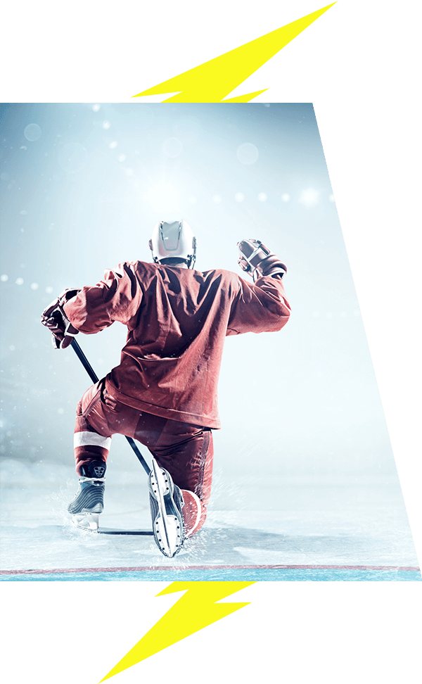 Hockey player on the ice celebrating goal lightning bolt image accents VI Storm Athletics