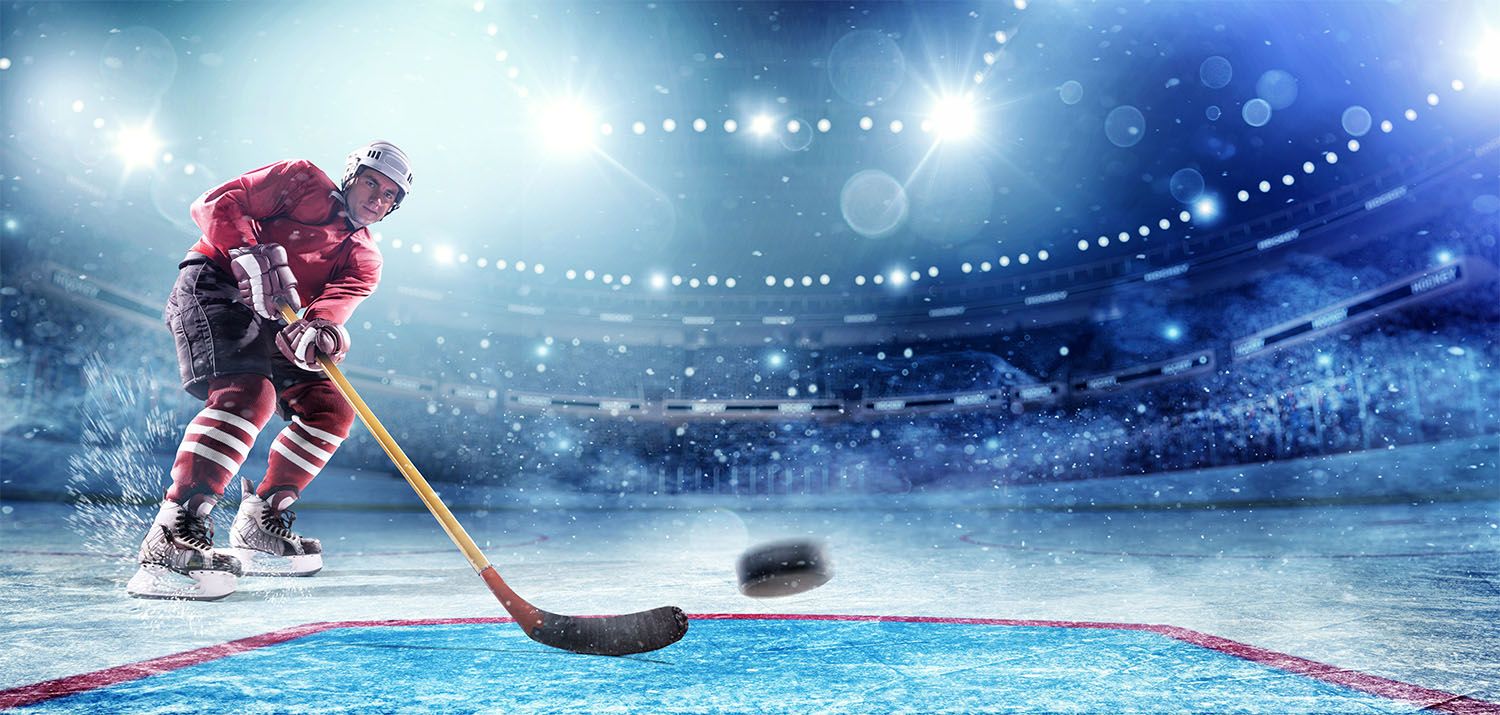 Goaltending making save with clouds to the left dark background