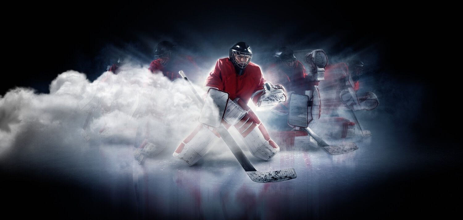 Goaltending making save with clouds to the left dark background